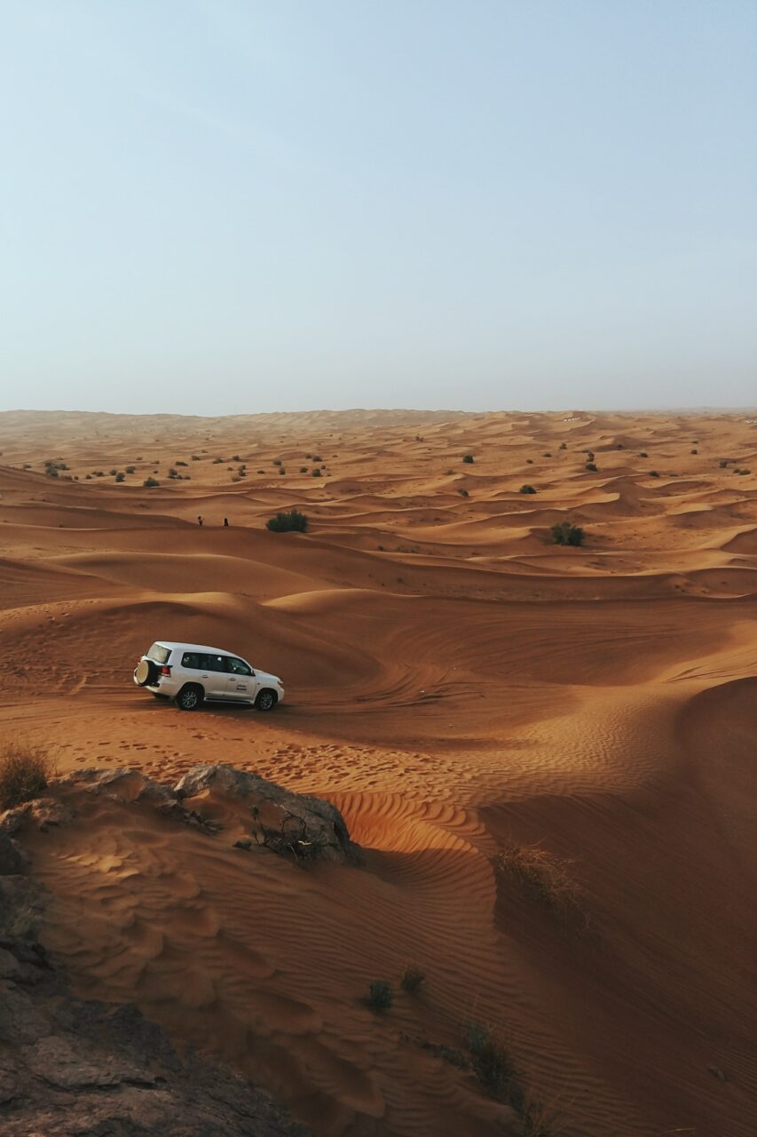 4x4 driving over the dunes in the Dubai desert