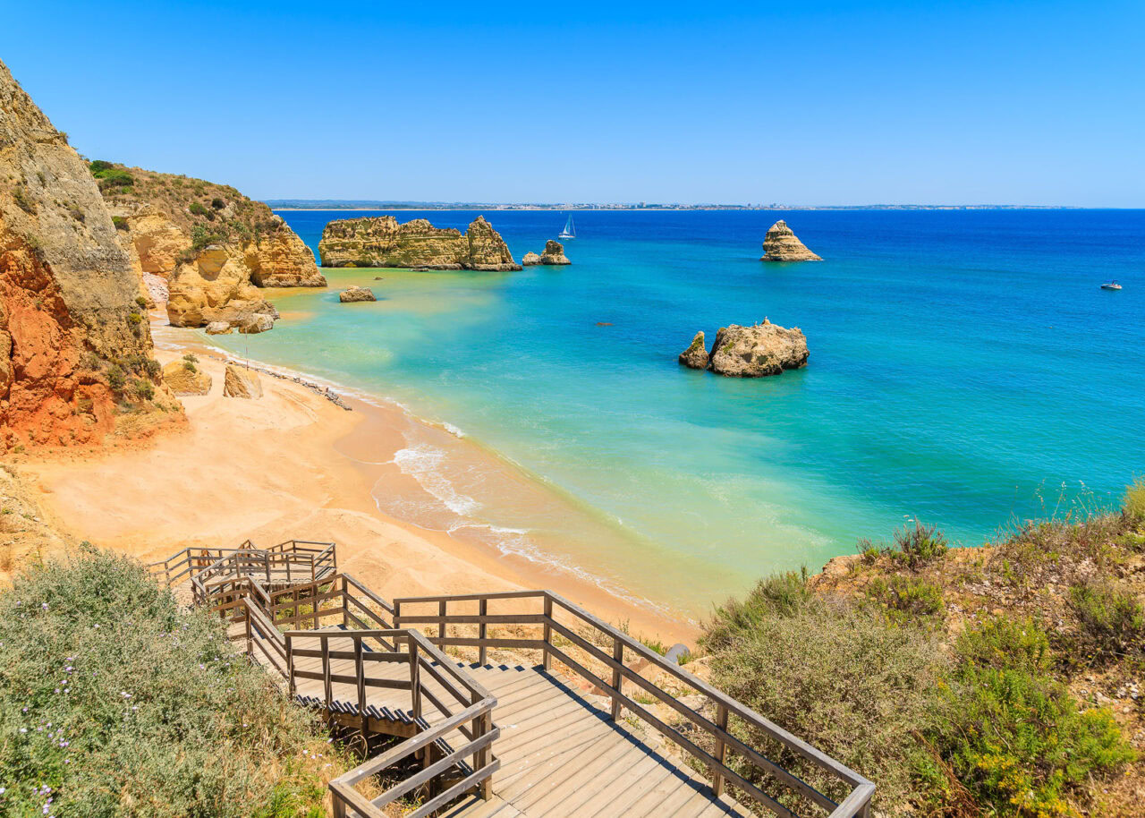 Praia Dona Ana beach with turquoise blue sea in Lagos, Portugal