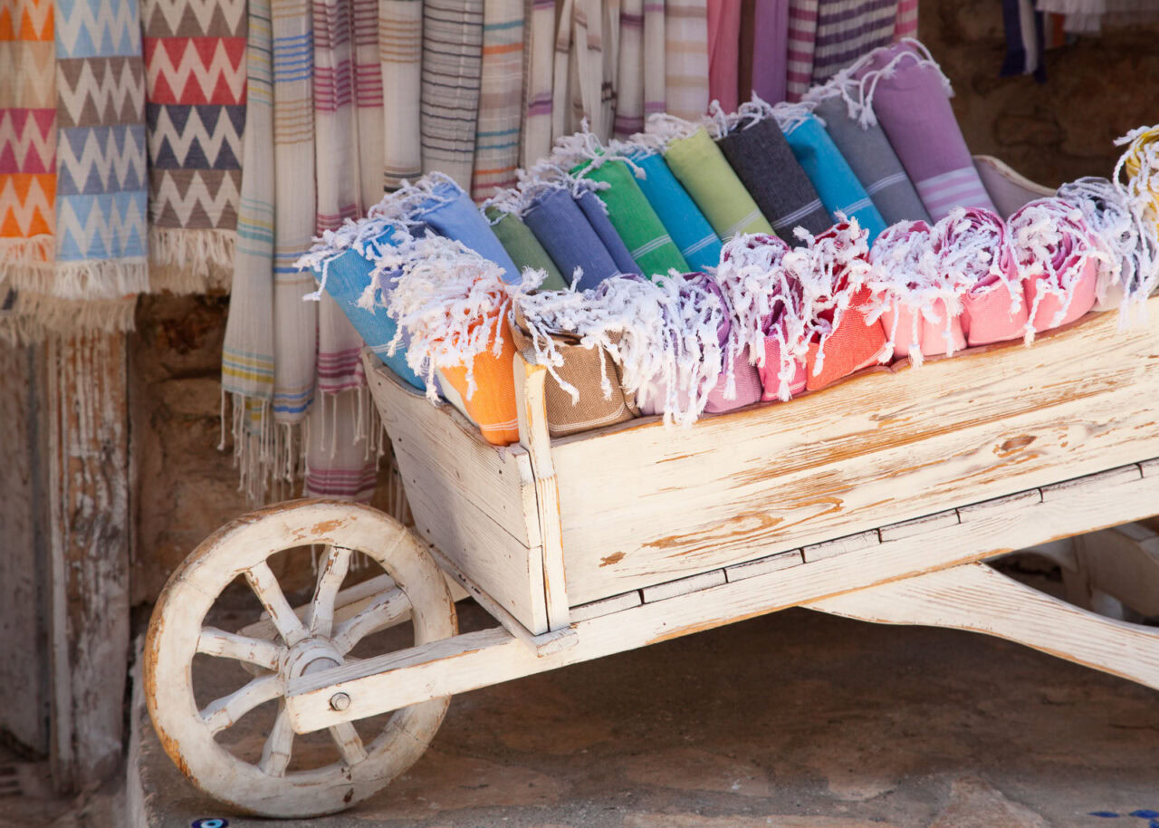 Turkish towels in a wooden cart in Bodrum