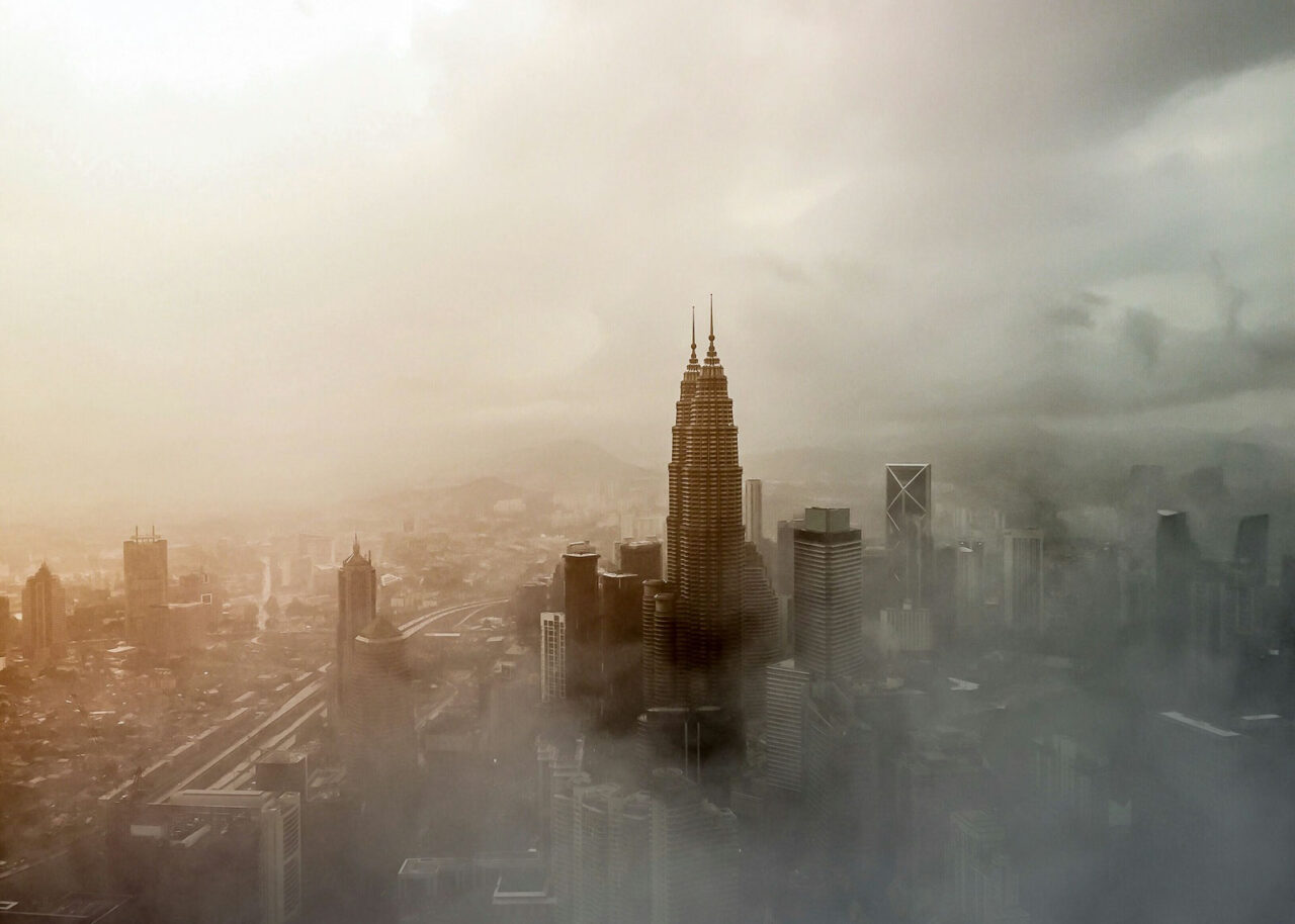Petronas Towers in Kuala Lumpur surrounded by smog