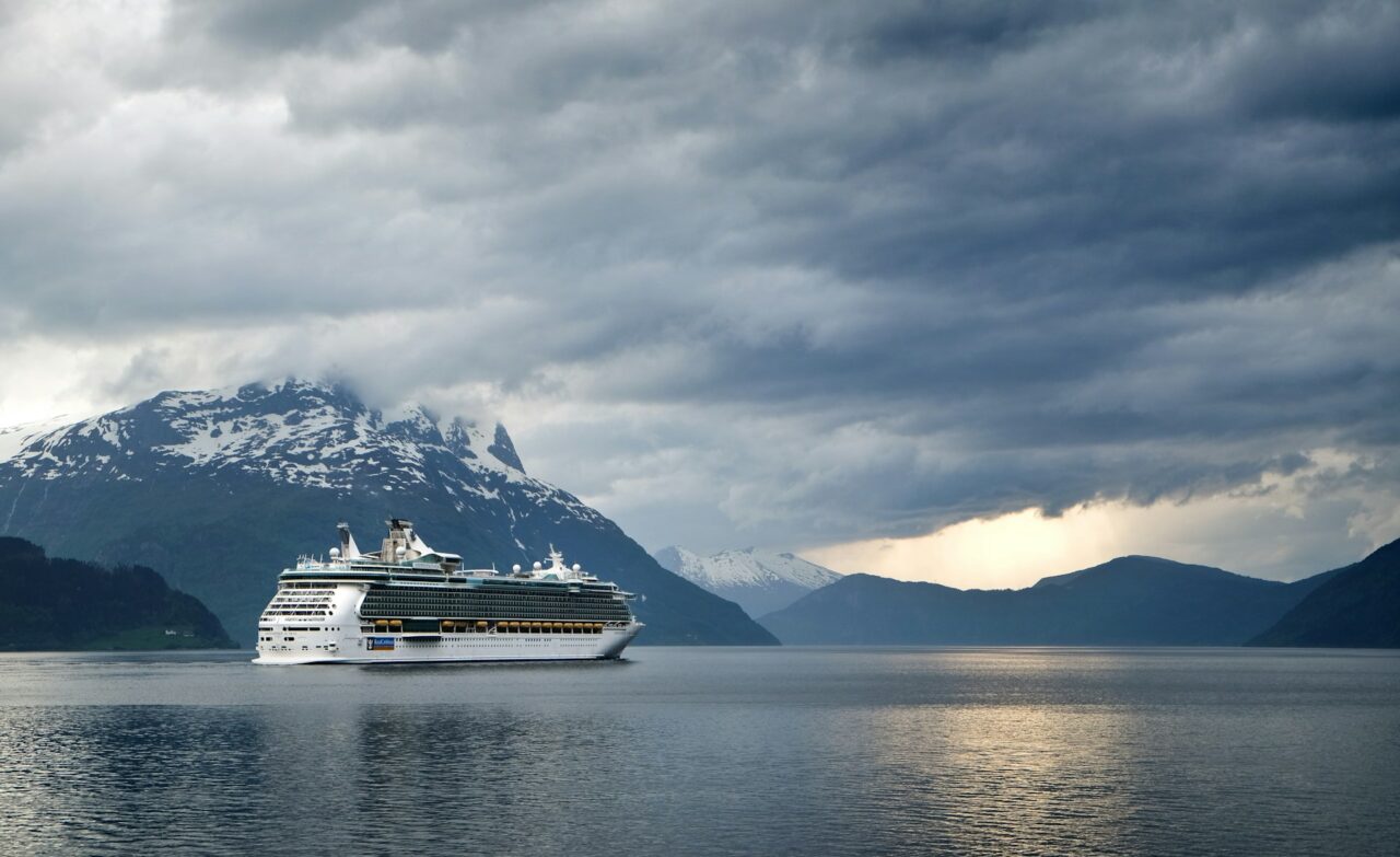 Cruise ship sailing down a fjord in Norway
