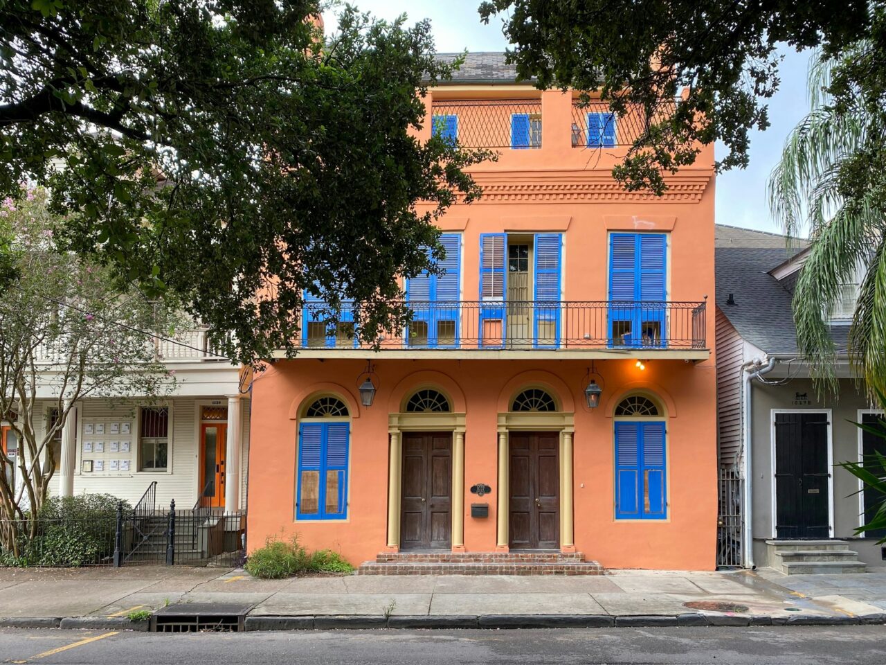 Orange building with blue shutters in New Orleans