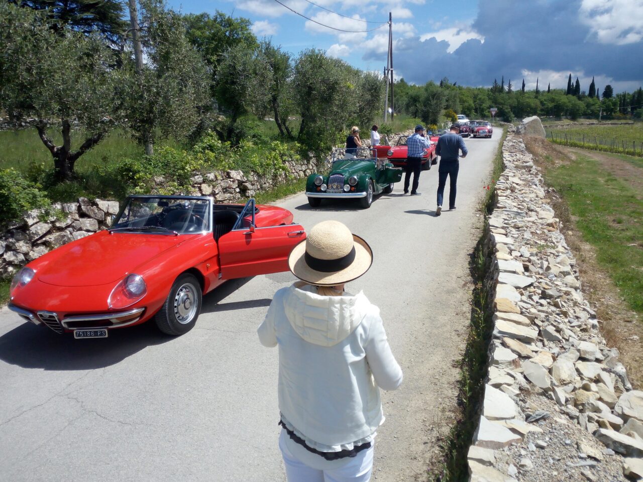 Group of tourists on a vintage car tour in Italy