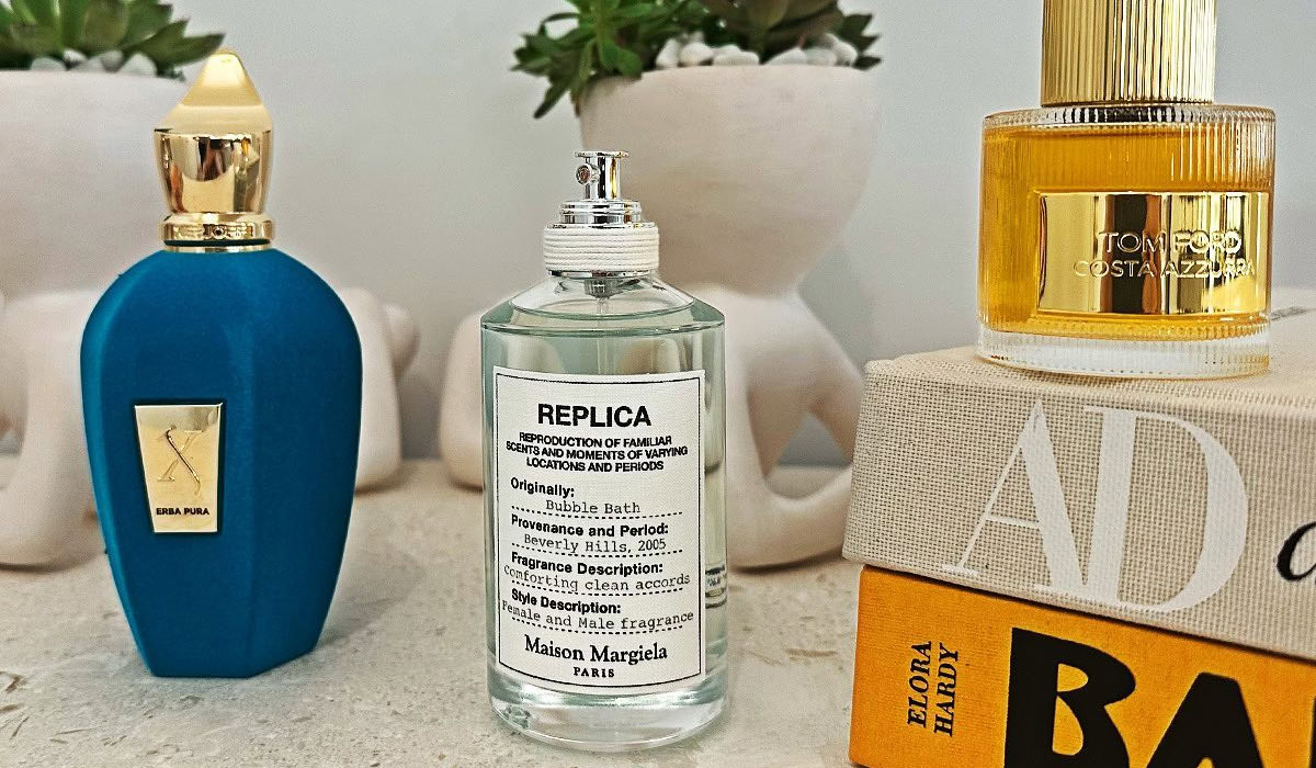 Luxury perfume bottles on a vanity with books